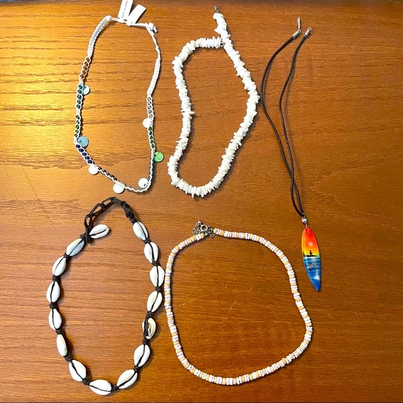 Jewelry - 5 beach themed necklaces. Puka shells. Surf board.